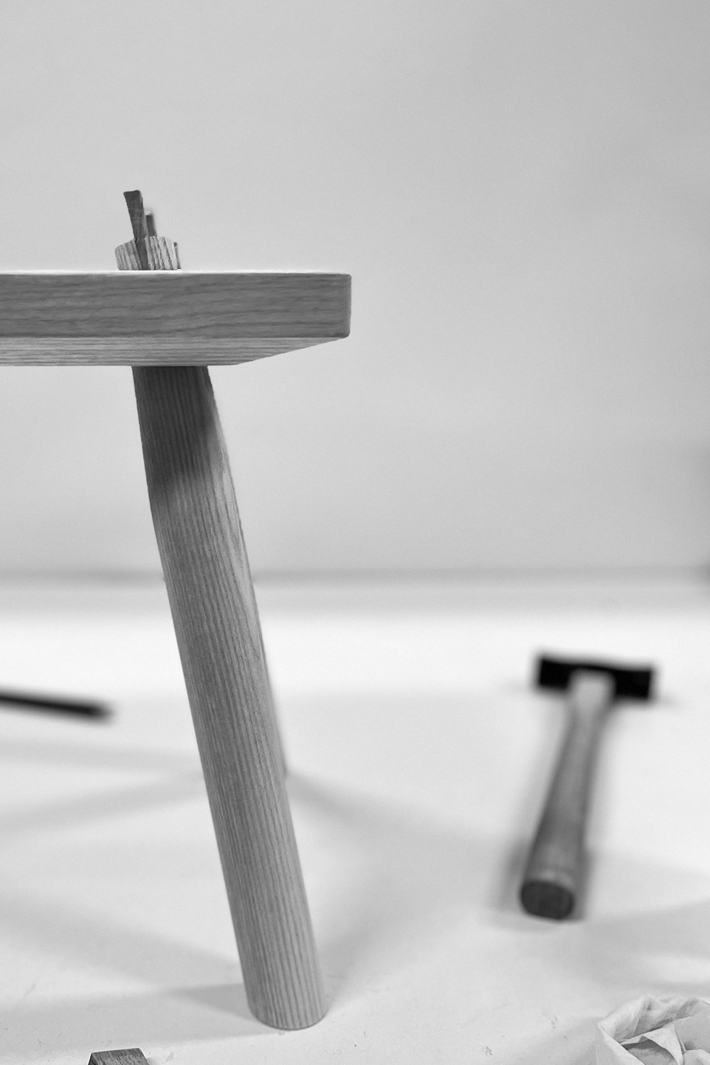 Wedged tenon joint on an ash bench, mallet alongside